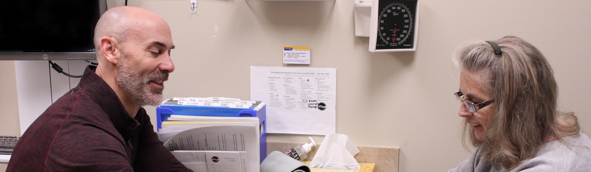 Dr. Schopp assesses patient hand