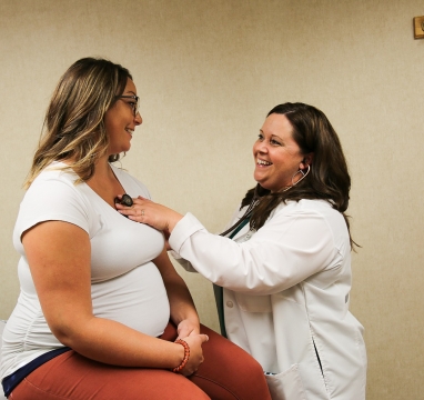 Nurse checking patients heart beat