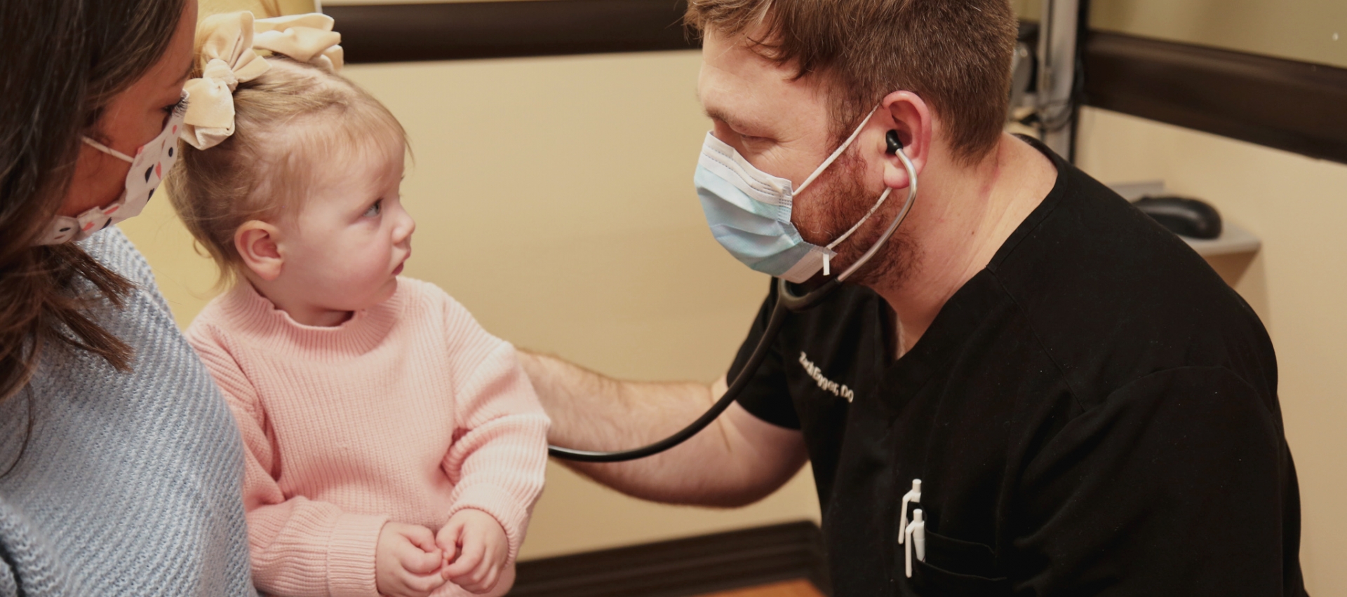 Dr. Egger listens to child breath sounds at Phelps Medical Group