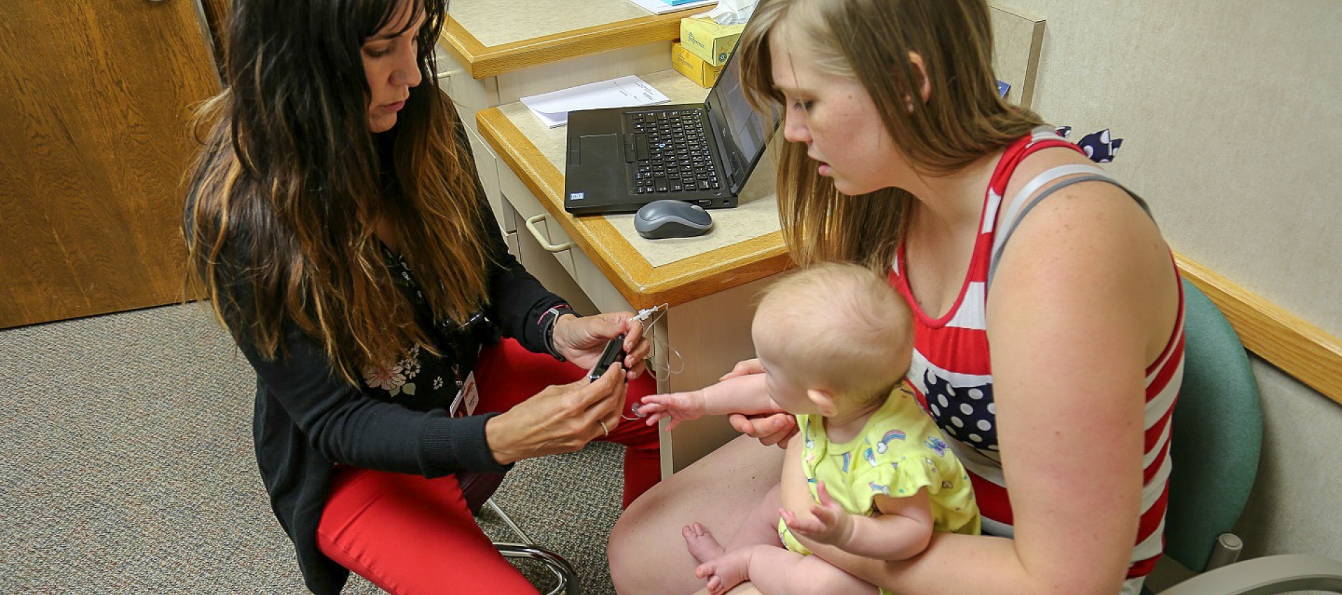 Nurse with kid and mom