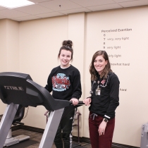 Patient on treadmill with exercise physiologist Laramey Becker